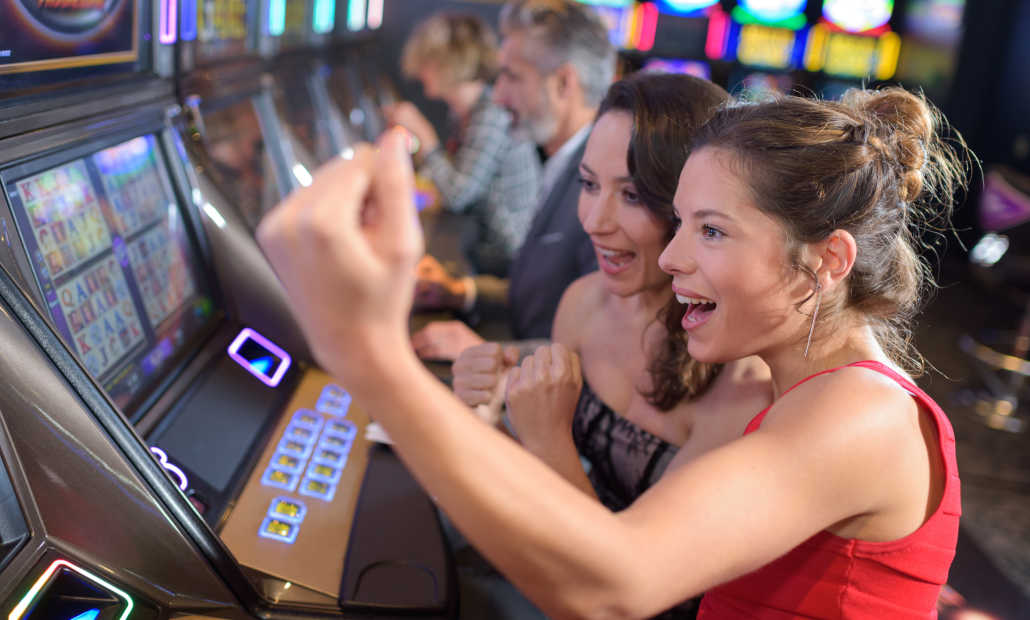 A calculator and casino chips representing slots bankroll management.