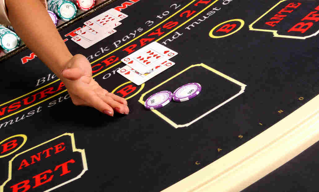 An online blackjack interface showing cards and betting options.