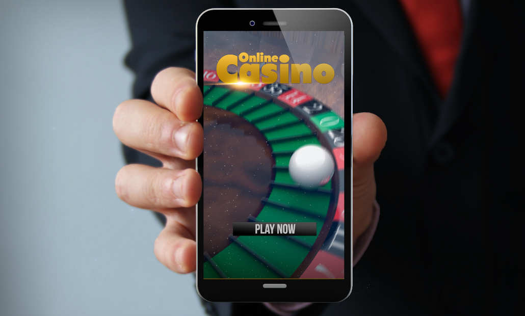 Dice, cards, and casino chips on a green felt table, representing online gambling.