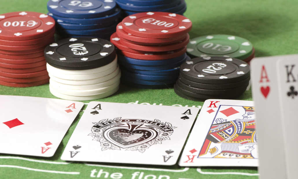 A poker table with cards and chips, representing local poker games.