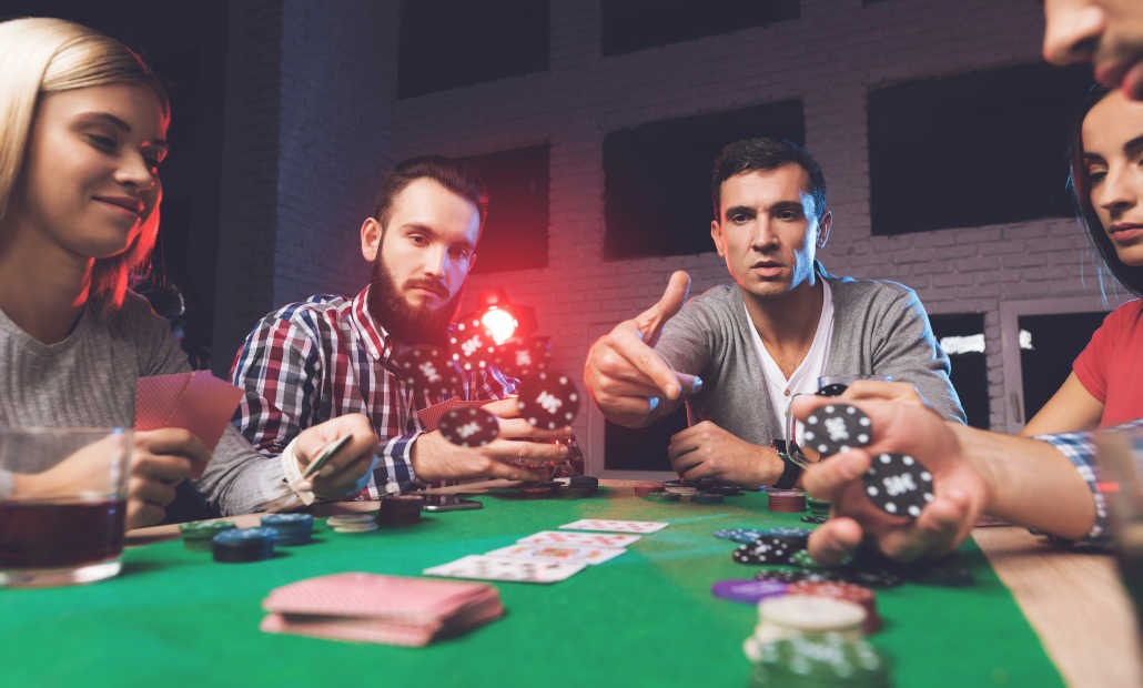 Friends playing a game of poker at home.