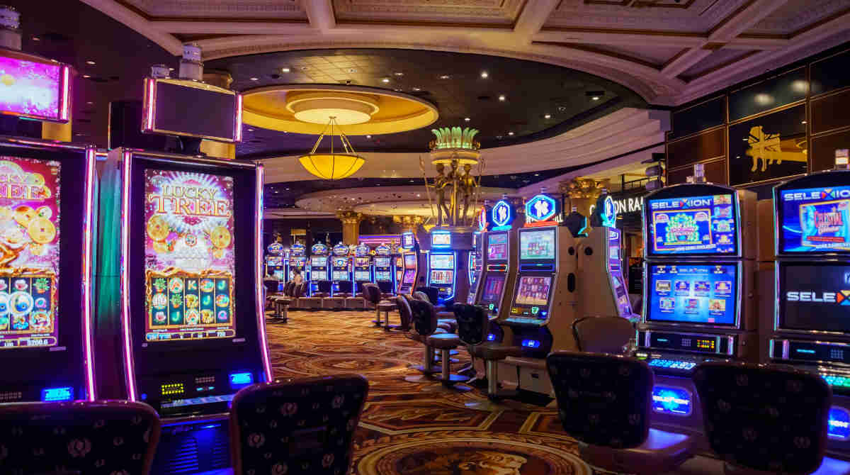 A collection of colorful pokie machines in a casino setting.