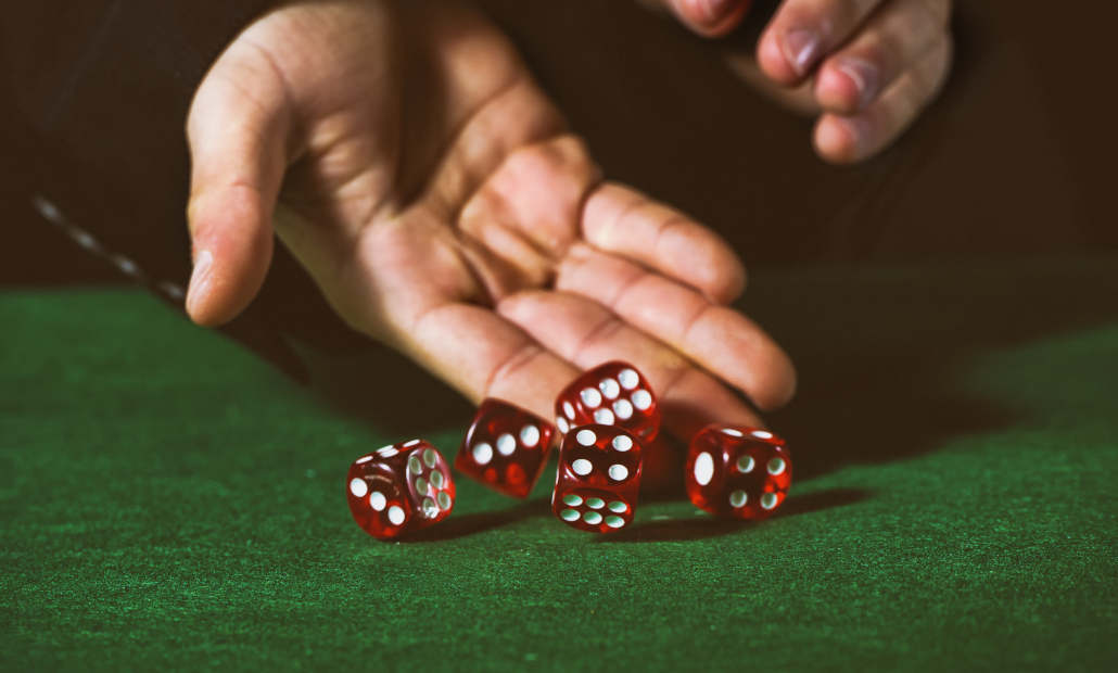 Close-up of three dice used in a game of Sic Bo.