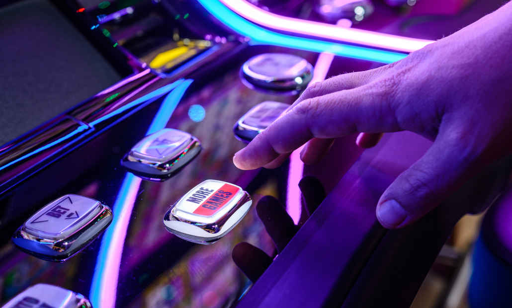 A slot machine with a frustrated player.