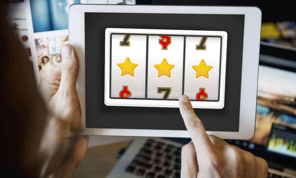 A person looking at a screen displaying a slot machine interface.