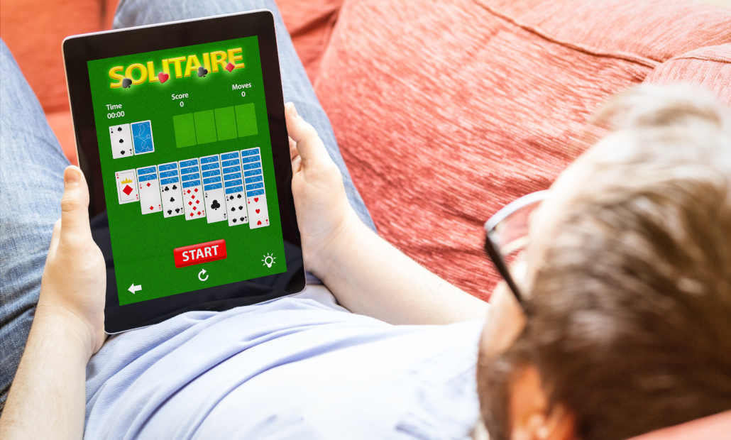 A vintage photograph of a casino floor, suggesting the history of Vegas Solitaire.