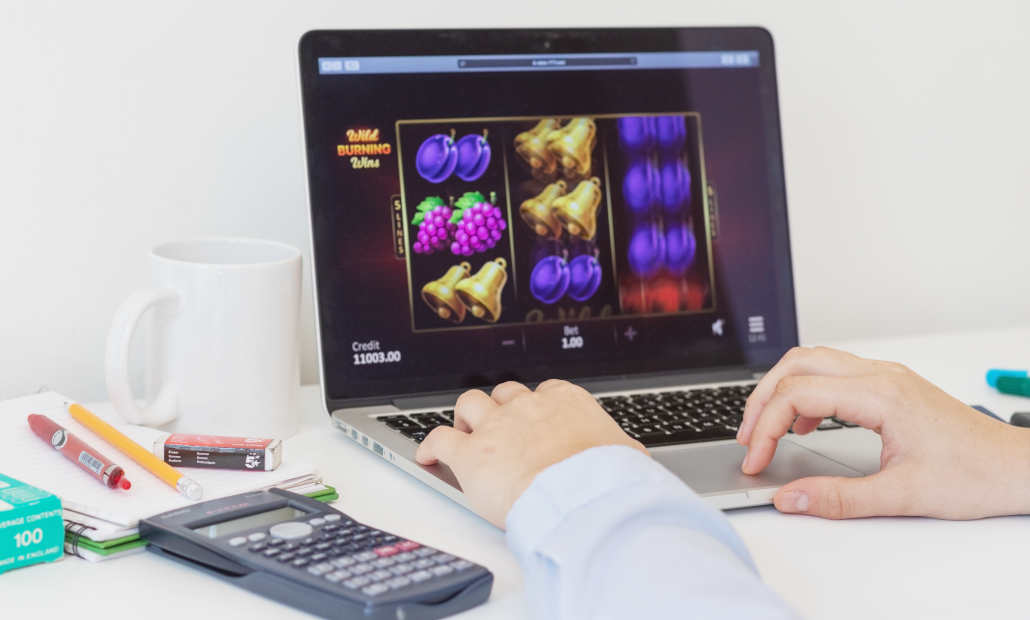 A graphic illustrating a casino slot tournament with trophies and coins.