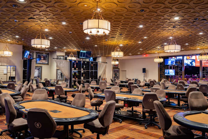Player considering placing chips on a blackjack side bet area.