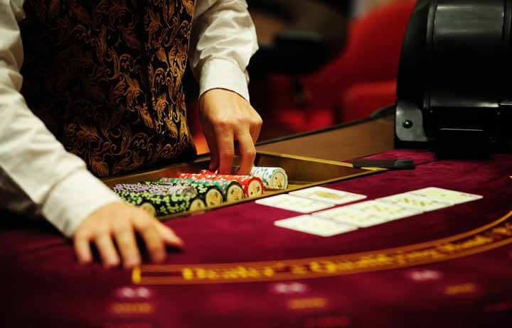 Player making a decision in a game of Caribbean Stud Poker.
