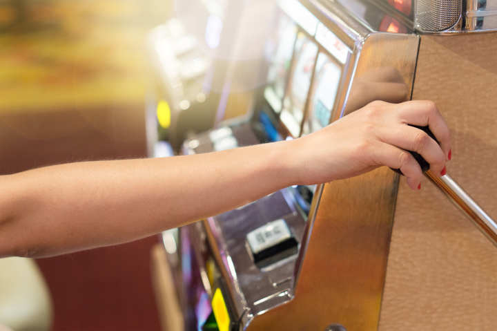 A clock and casino chips symbolizing the need to set time limits for gambling.