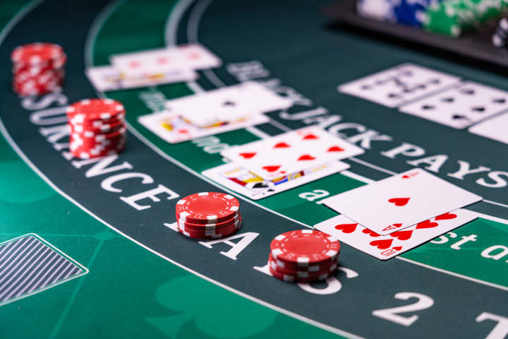 A blackjack table showing the insurance bet line.