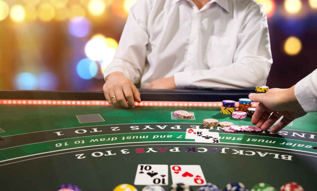 A blackjack table with cards and chips.