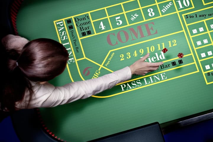 A craps table showing the basic layout and dice.