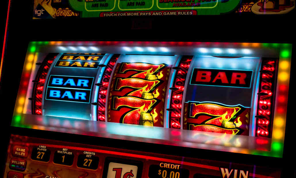 A row of colorful slot machines in a casino.