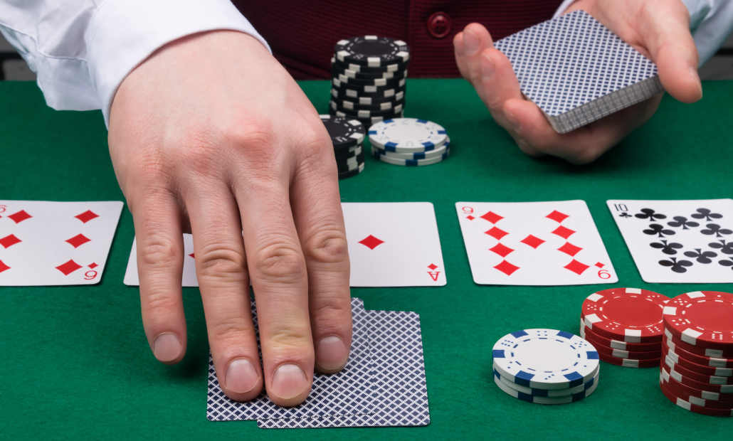 A close-up of Texas Hold'em cards on a poker table.