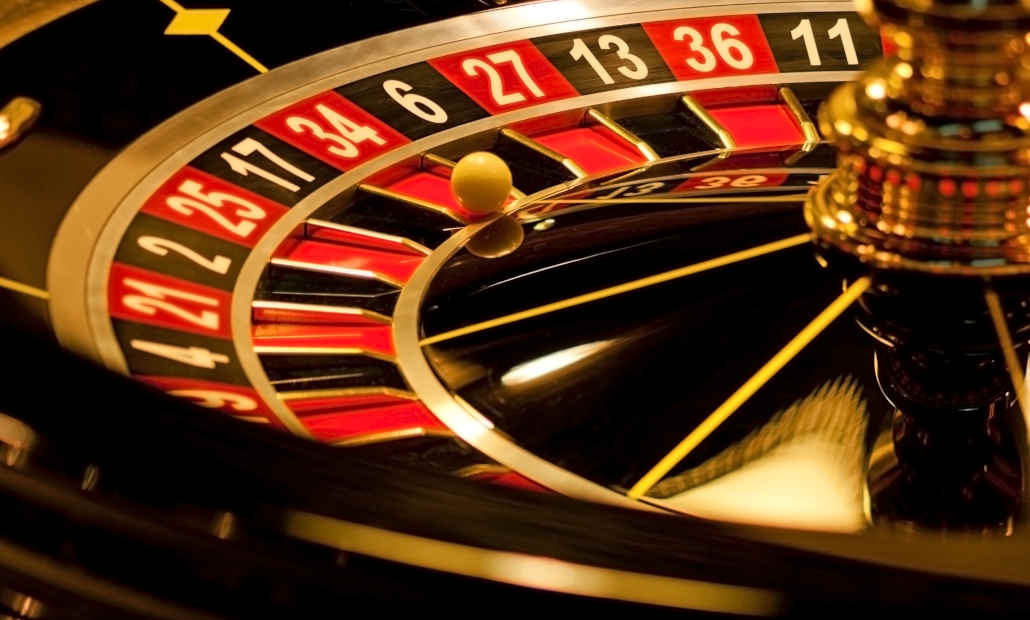 A roulette wheel spinning in a casino.
