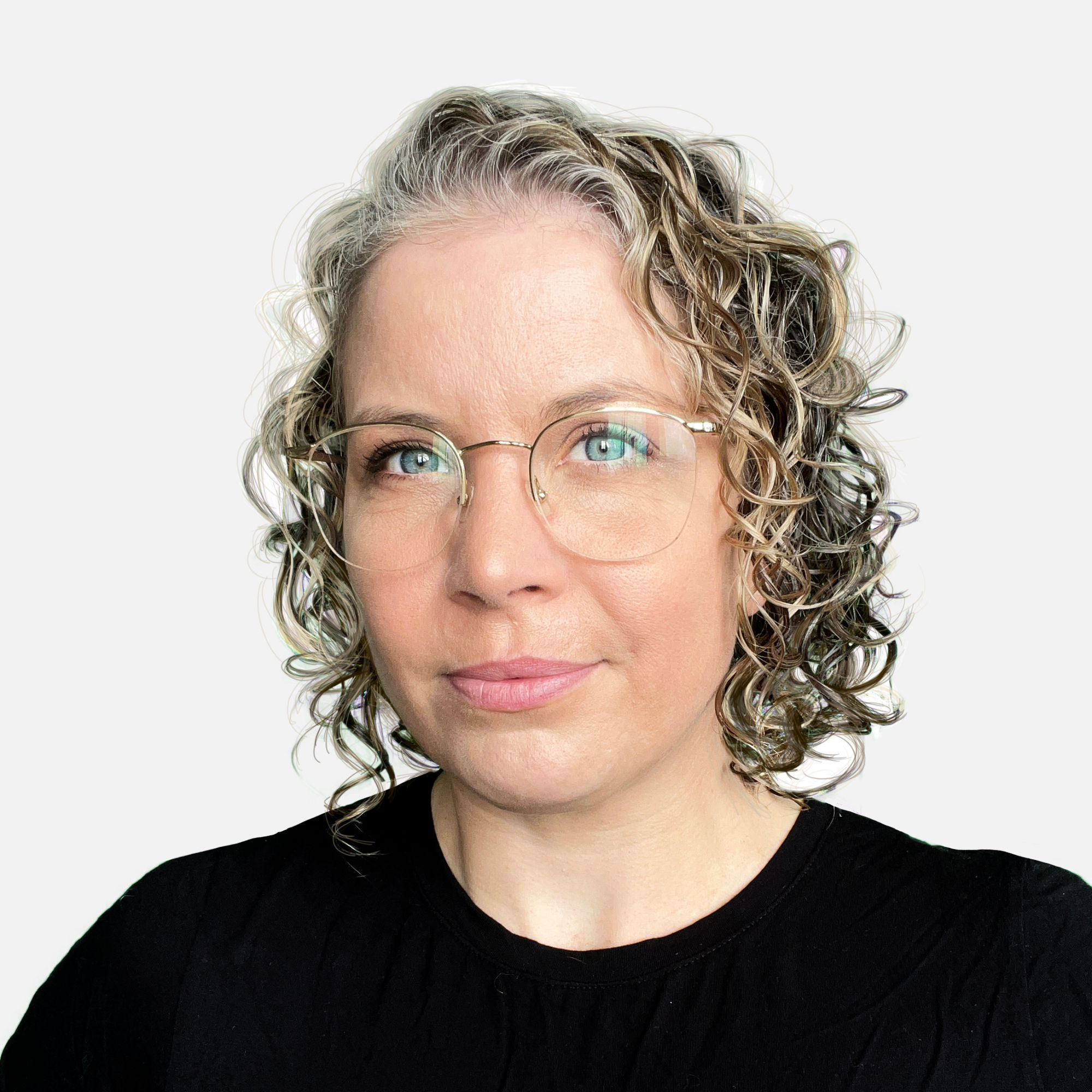 A photo of Hannah the founder of Jimmy. She has curly hair, glasses, and is looking direct at the camera.