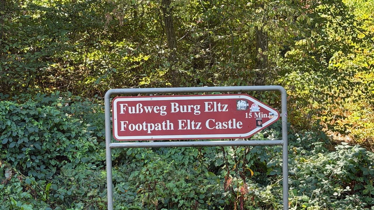 Burg Eltz with its towers rising above the forest