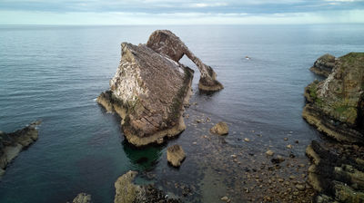 Bow Fiddle Rock - a natural sea arch as seen from some height (drone photo)