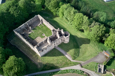 Balvenie Castle among green trees - drone photo