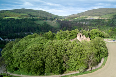 Drone photo of Balvenie castle - hardly visible in the green vegetation