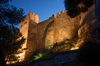 A view at the Cullera Castle from below in the dusk