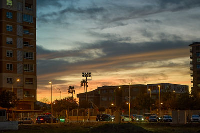 Cullera, Spain 3.13.2023 Golden dusk paints a picturesque backdrop for the elegant clock towers and cityscape nestled amidst the bustling streets