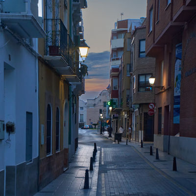 Cullera, Valencia, Spain - 05.21.2023 The perfect blend of old and new: A bustling city street featuring classic architecture, modern buildings, and the hustle and bustle of daily life.