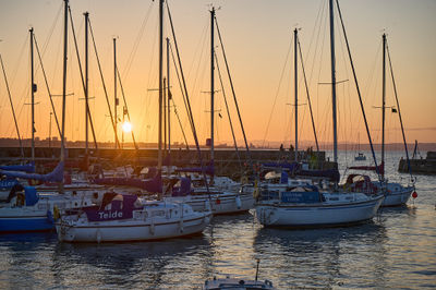 Sunset over Musselburgh harbour with moored boats