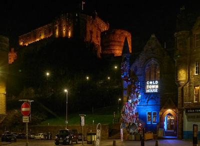 Night view on illuminated Edinburgh Castle from Grassmarket