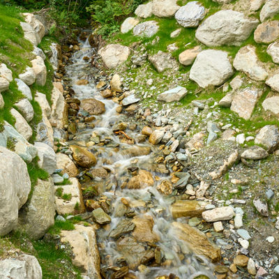 A village in Swiss Alps - a water stream