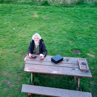 A dronie of myself - sitting at a table with a cap of coffee