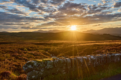 A magnificent sunset over Scottish highlands and glens