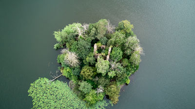 Aerial photo of a little island with a ruins of a castle