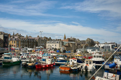 A busy harbour in a Scottish town