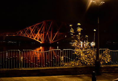 Forth Rail Bridge at night. Red railroad bridge over Firth of Forth
