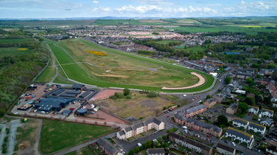 Musselburgh Racecourse, drone photo. A green field and a town