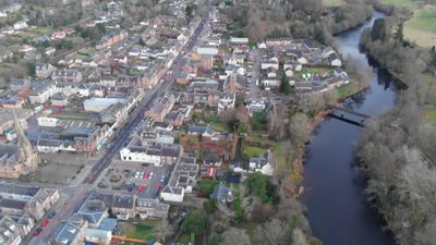 Drone footage. Flying over the town of Callander and river Teith. Scotland, Highlands