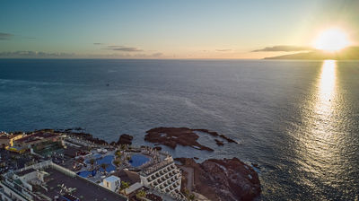 Tenerife coast - sunset over the ocean - aerial photo