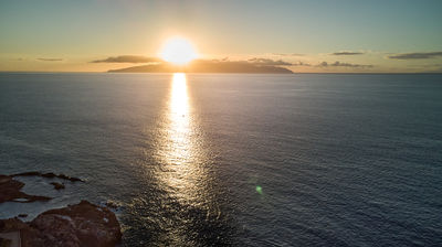 Tenerife coast - sunset over the ocean - aerial photo