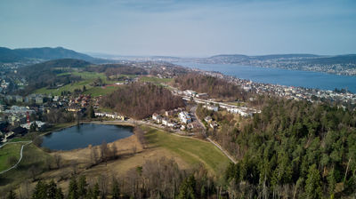 Aerial view of a forest and villages near Lake Zurich