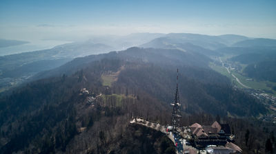 Drone view on Uetliberg mountain in Zurich. Panoramic view with Lake Zurich and Alps on horizon