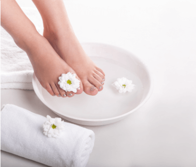 Wellness pedicure - foot bath, exfoliation, and massage.