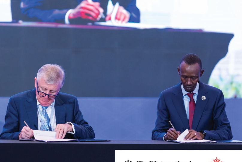 Joe Moynihan and Nick Barigye signing the MoU