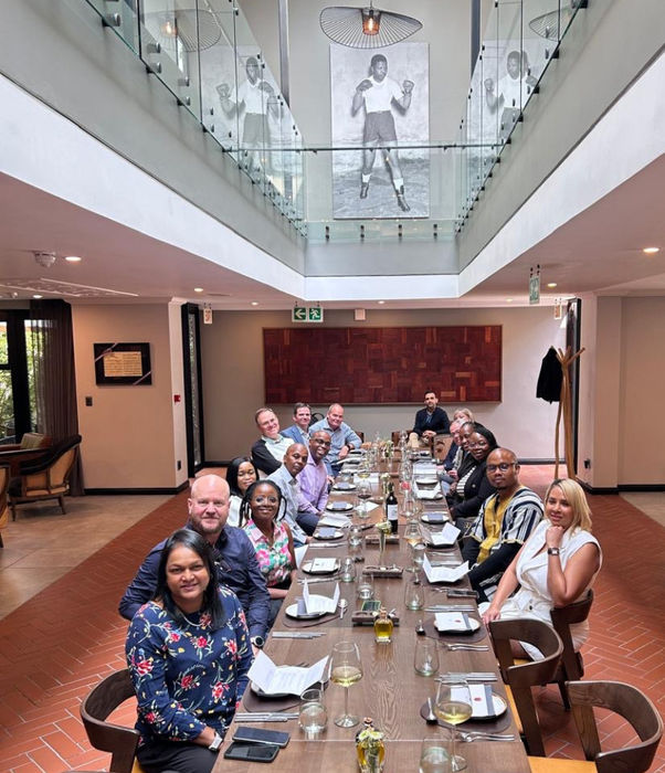 Group of people sitting at a roundtable event