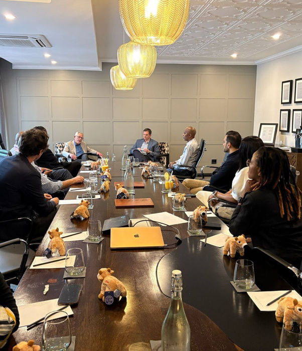 Group of people sitting at a roundtable event