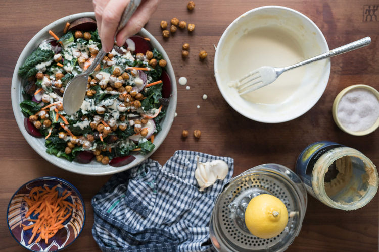 Roasted Chickpea and Kale Salad being dressed