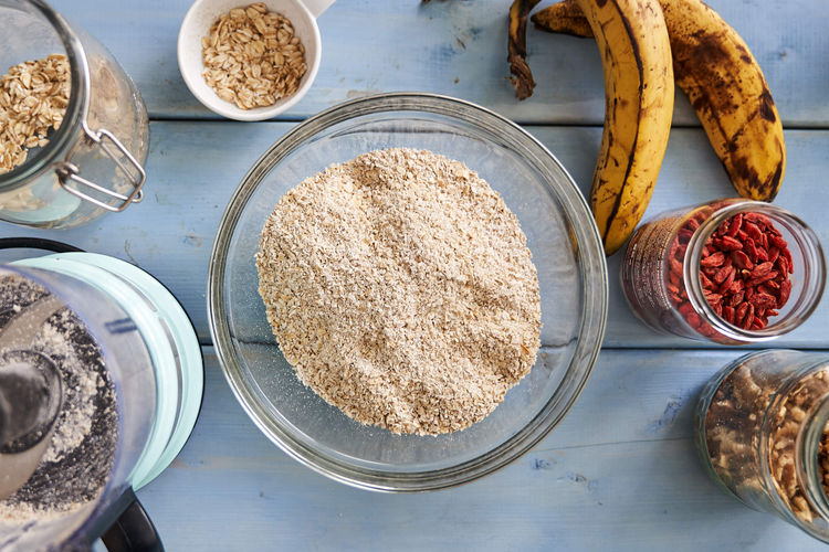 Grounds oats in a bowl for superfood granola bars