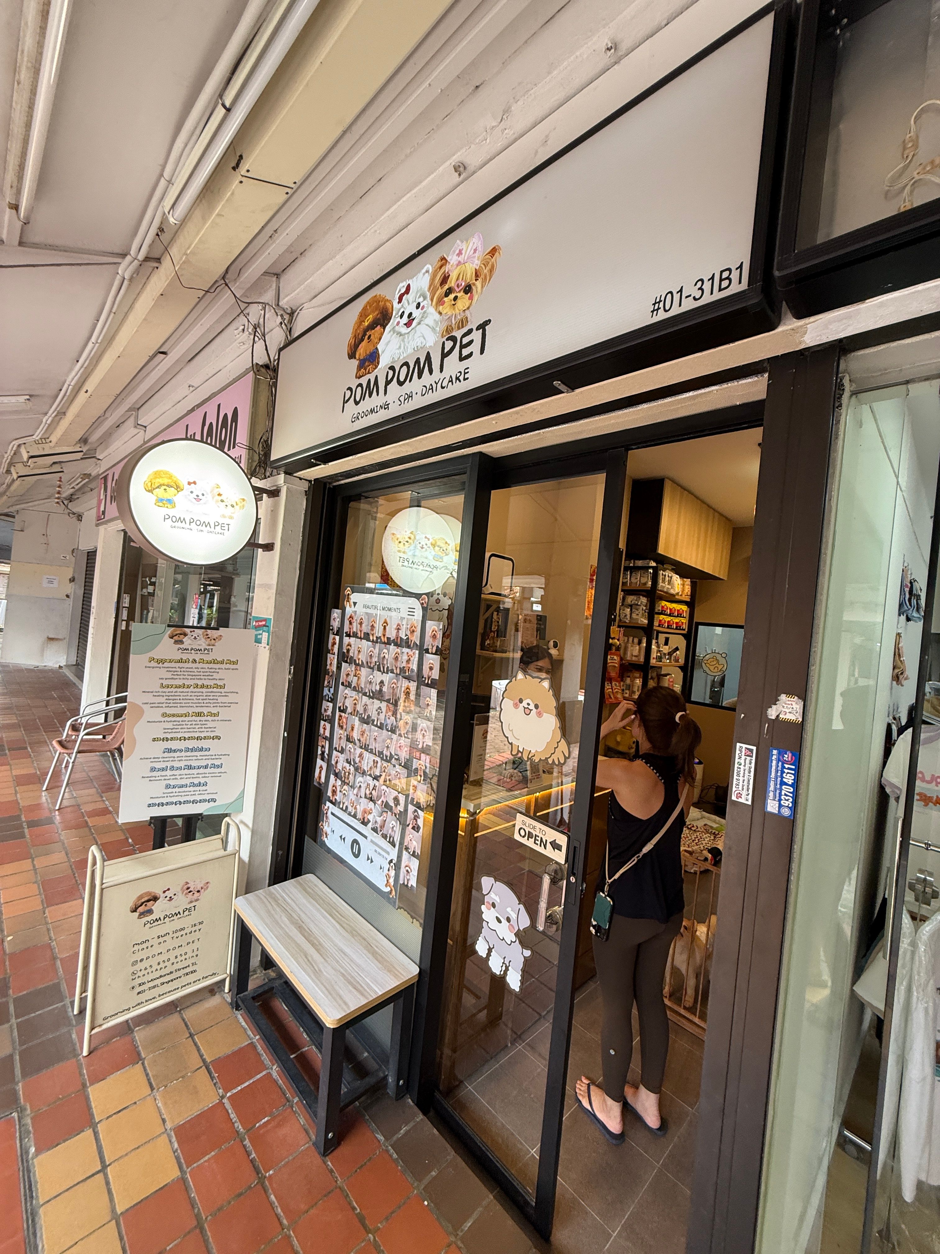 PomPom Pet Woodlands storefront at Block 302 with POM POM PET grooming spa daycare sign