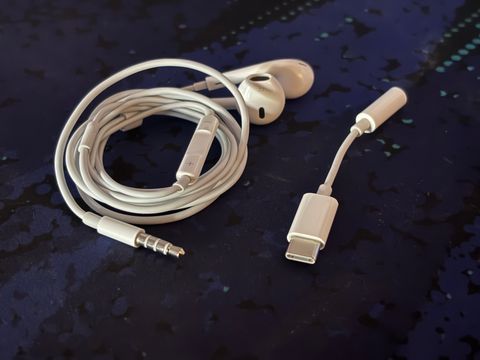 A photo of Apple EarPods with an Aux to USB-C adaptor.